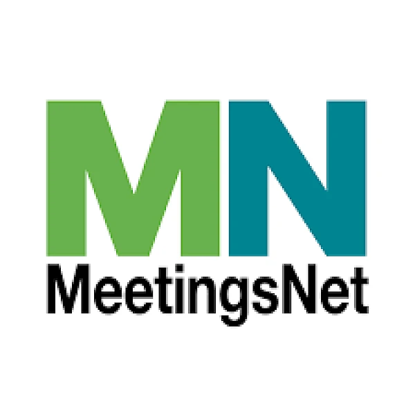 The image shows a logo with large letters "MN" in green and blue above the word "MeetingsNet" in black text on a white background.