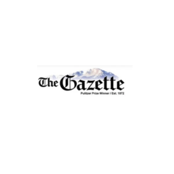 This image shows the logo of "The Gazette," with a mountain graphic in the background and text indicating "Pulitzer Prize Winner / Est. 1872."