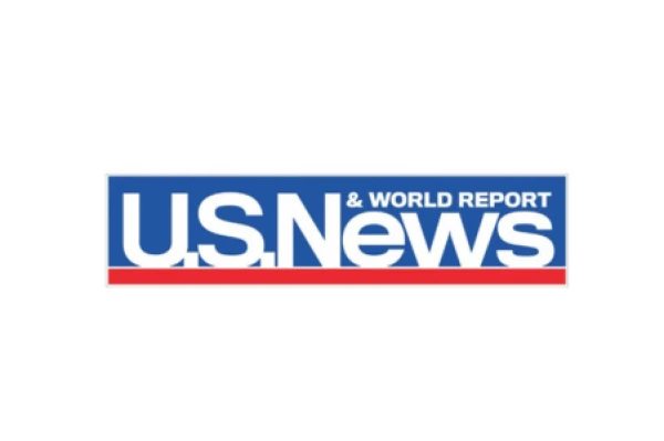 The image shows the logo of "U.S. News & World Report," with "U.S. News" in bold white letters on a blue background, and a red stripe below.